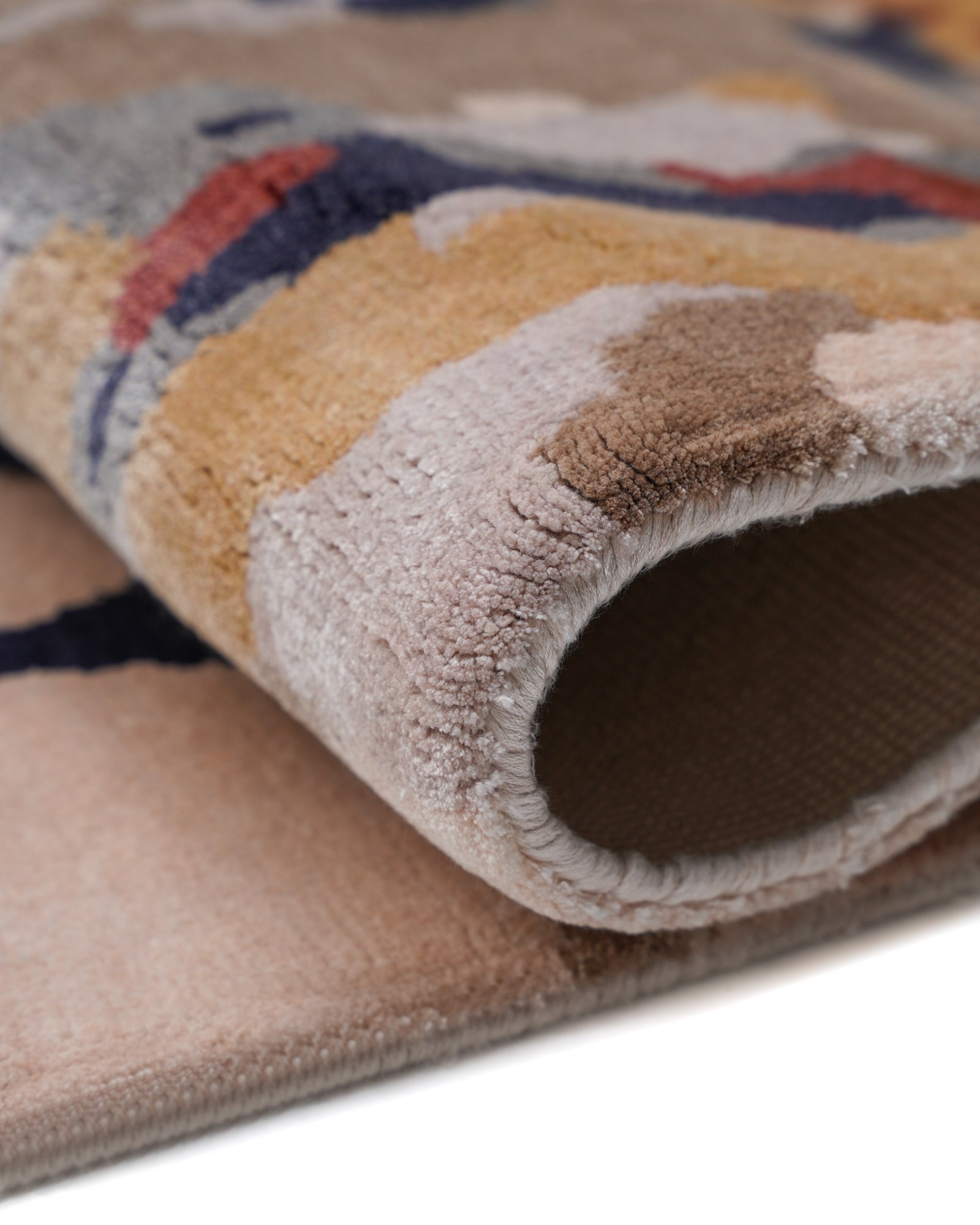 Folded View Blush and Navy Abstract Drip Hand-Tufted Bamboo Silk Rug