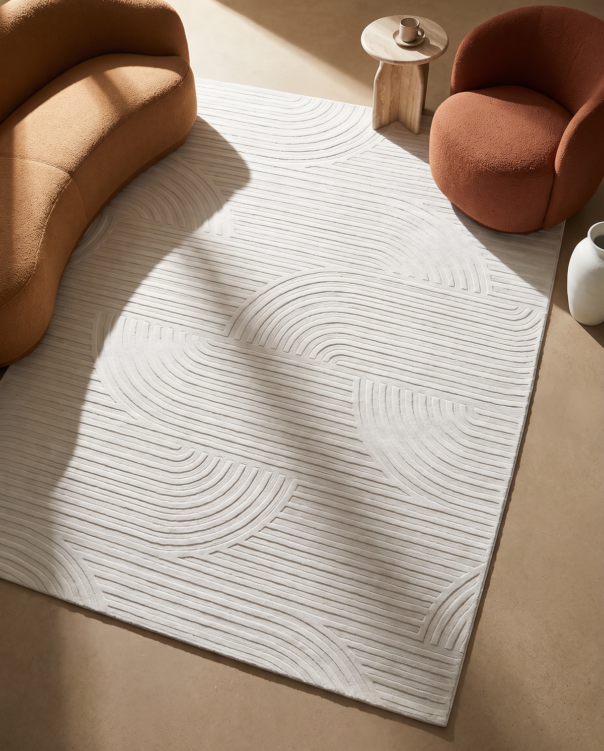 Ivory white carved Meander bamboo silk rug in a modern living room